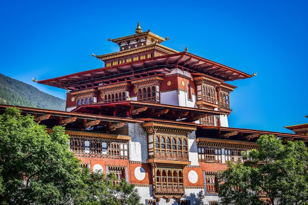 Serene Bhutanese monastery surrounded by lush greenery, offering a glimpse into Bhutan's rich culture and tranquility. Explore B2B tour packages for Bhutan with ease.