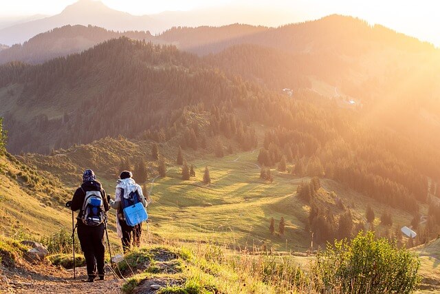 2 people trekking in the mountains