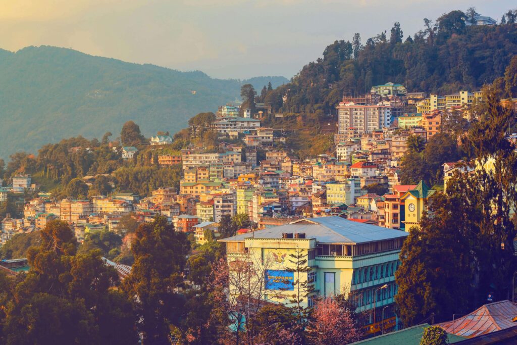 a sunset view of a town in sikkim
