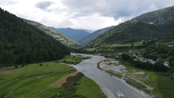 Roads surrounded by green hills and forest