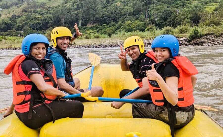 a group of people rafting in river